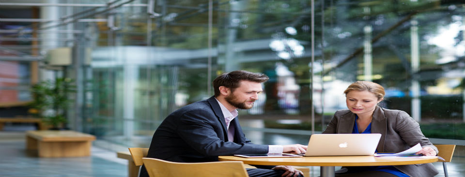 Man & Woman looking at laptop 960x366 Man & Woman looking at laptop 960x366